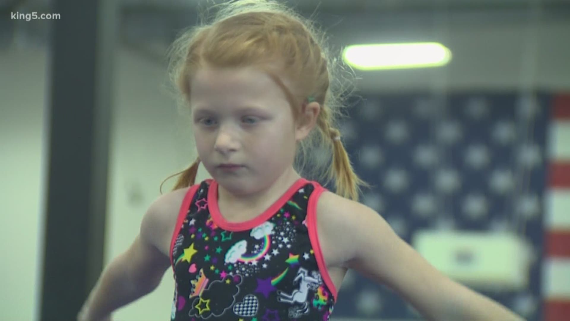 Abbey is 7-years-old. She is a budding gymnast with progressive hearing loss, and is out to show other kids with disabilities that they can do anything they put their mind to.