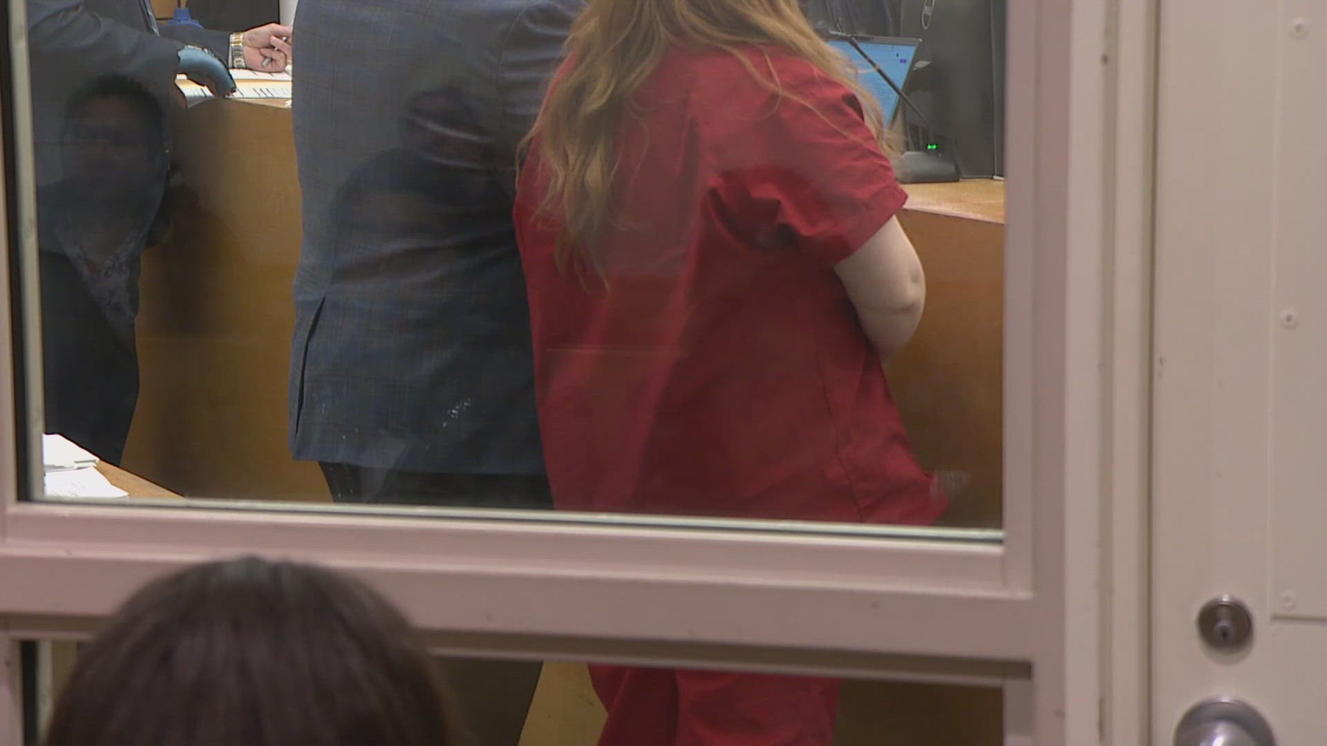 A woman accused of fatally stabbing a man in Seattle's Belltown remains jailed on $2 million bail after a SWAT standoff arrest.