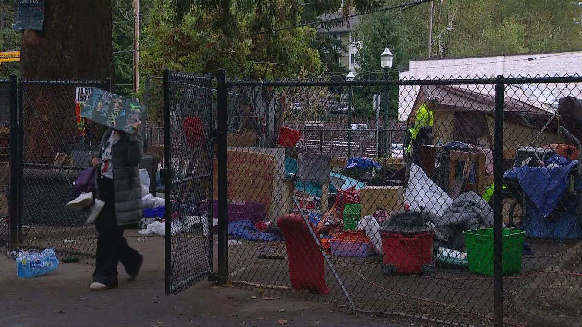 King County workers are cleaning up a homeless encampment outside of the Burien courthouse