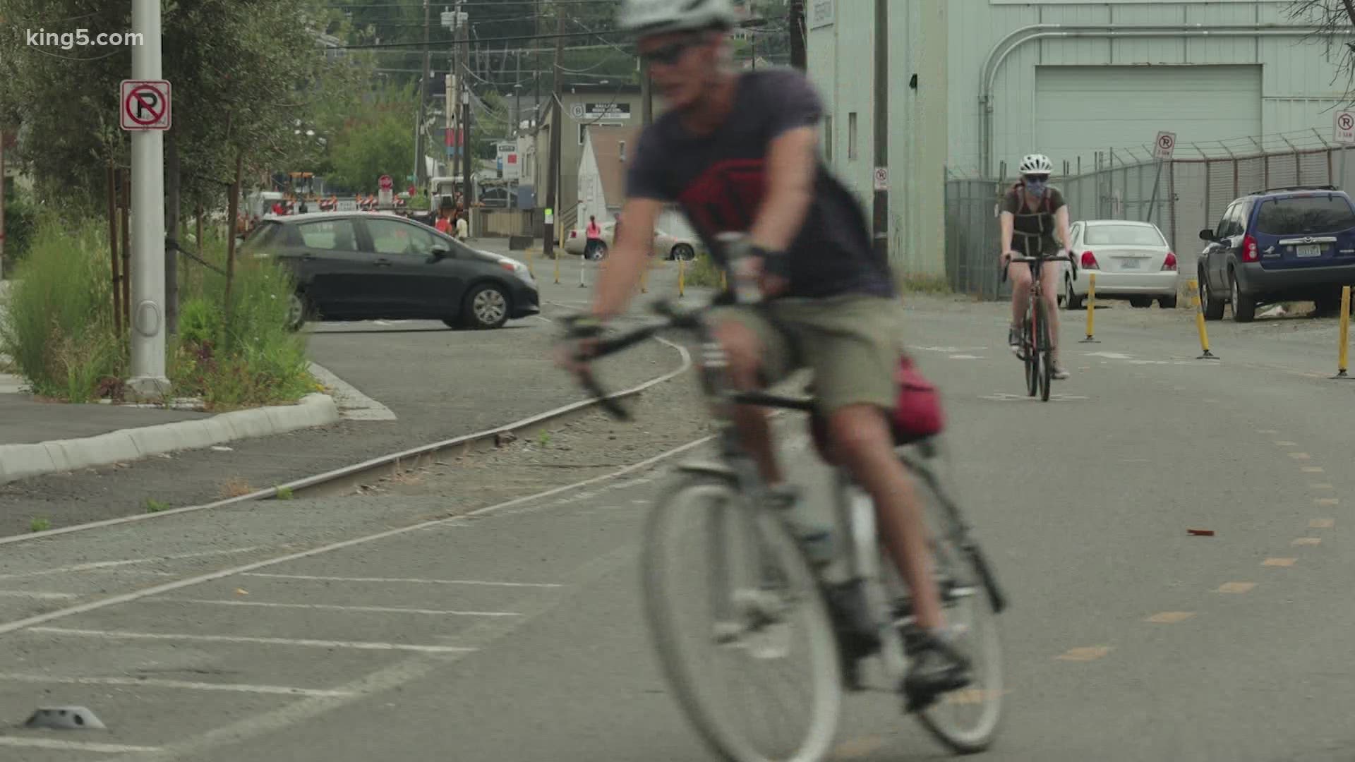 City of Seattle plans to appeal after a court said it lacks authority to move a train track in Ballard to link the trail. Cyclists say it is the safest option.