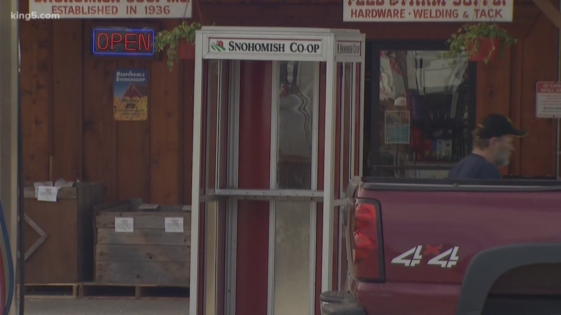 One antique shop is selling phone booths and vintage soda machines.