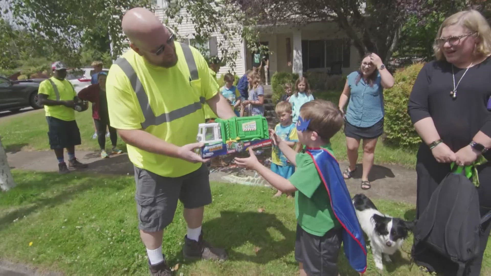 More than a dozen garbage and recycle trucks paraded through a DuPont neighborhood to cheer up a young boy.