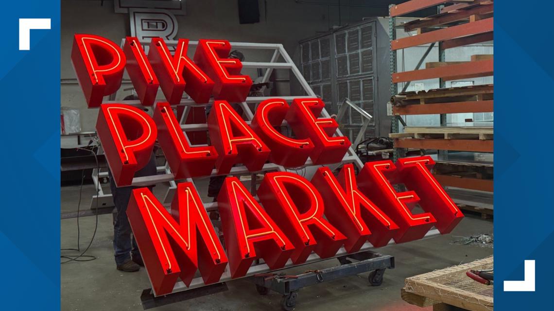 Pike Place Market installs new sign; original sign remains facing Pike Street