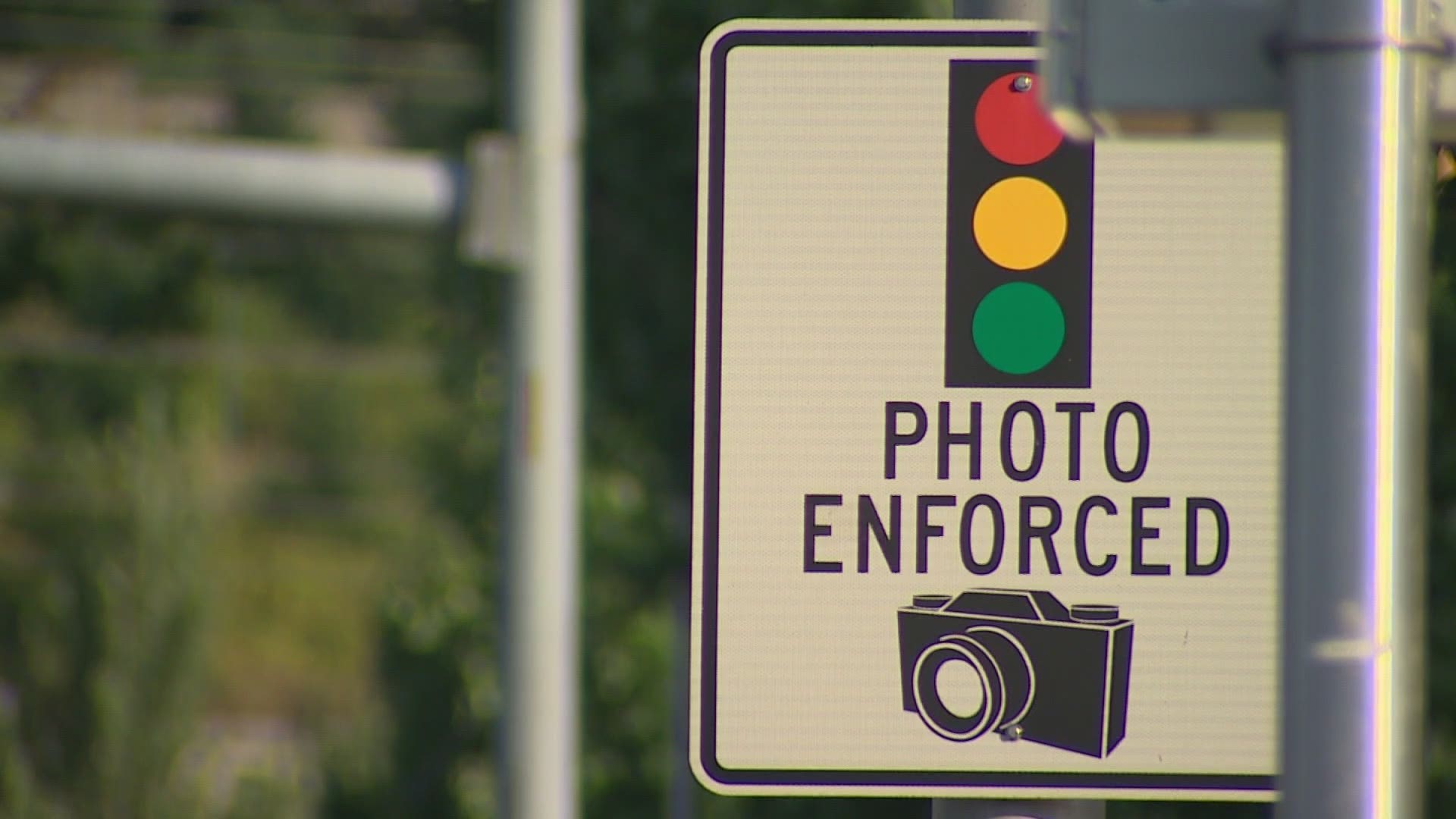 Renton police are warning drivers of a scam that tricks them into paying fake red-light camera tickets.