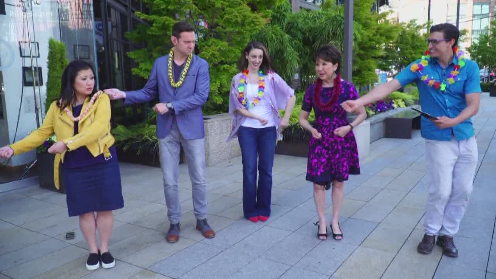 Our beloved anchor, Lori Matsukawa, shows the Take 5 gang how to hula dance.
