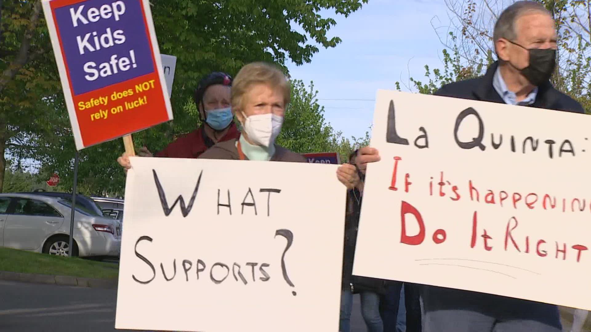 Some Kirkland residents are protesting a plan to turn a former La Quinta motel into housing for the homeless.
