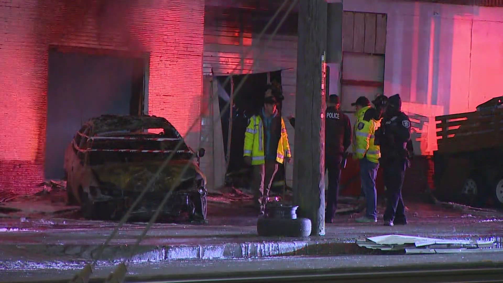 The driver in a Seattle hit-and-run crash that caused a building fire is dead and the passenger of that vehicle is in custody