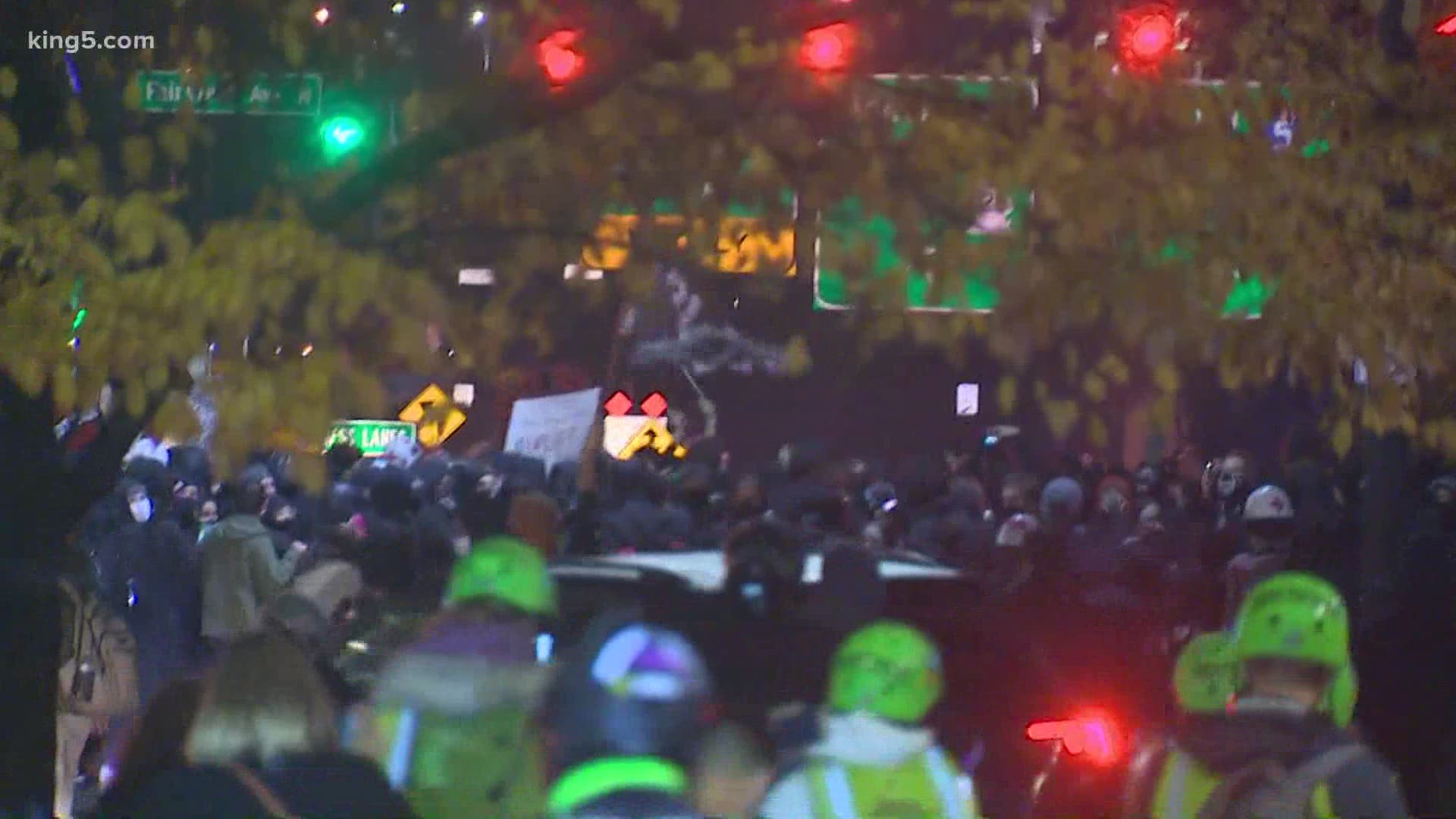 Demonstrators took over Mercer Street in downtown Seattle on Election Night, marching toward I-5 as police monitored the marches.