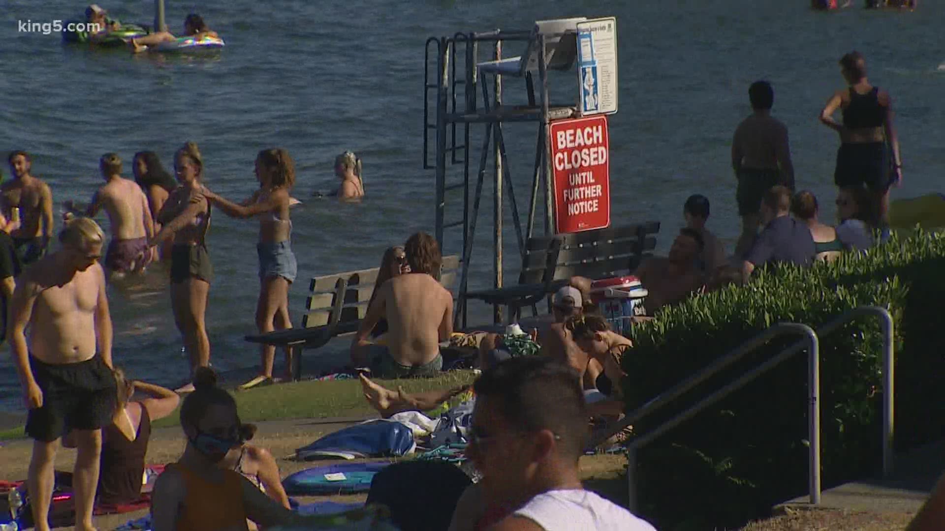 Closed swimming beaches in Seattle are not staffed with lifeguards, and the parks department urges beachgoers to stick to grass and sand areas.
