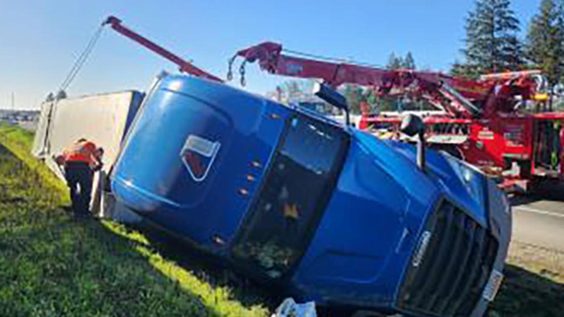 Semi-truck with 50K of dog food in it crashes north of DuPont | king5.com