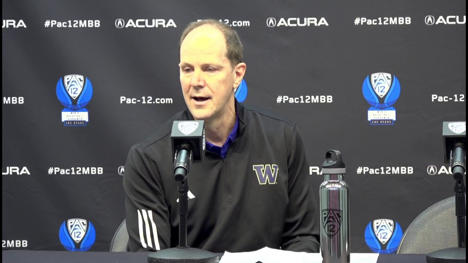 UW basketball head coach Mike Hopkins speaks at a press conference with player Keion Brooks Jr. after Washington's 80-74 loss to USC on March 13.