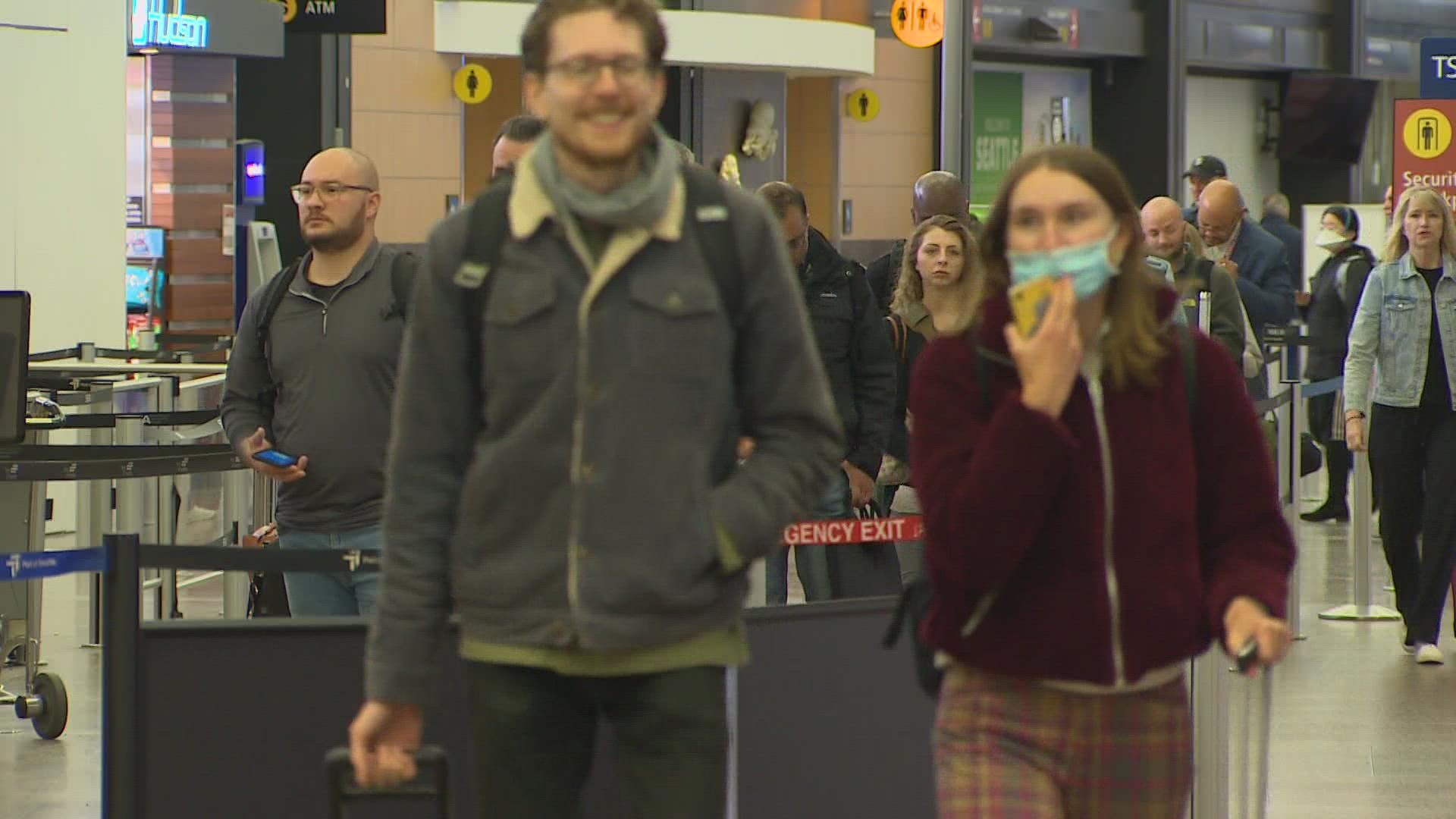 Plenty of passengers at Sea-Tac Wednesday still had their masks on, despite the new optional policy at the airport.
