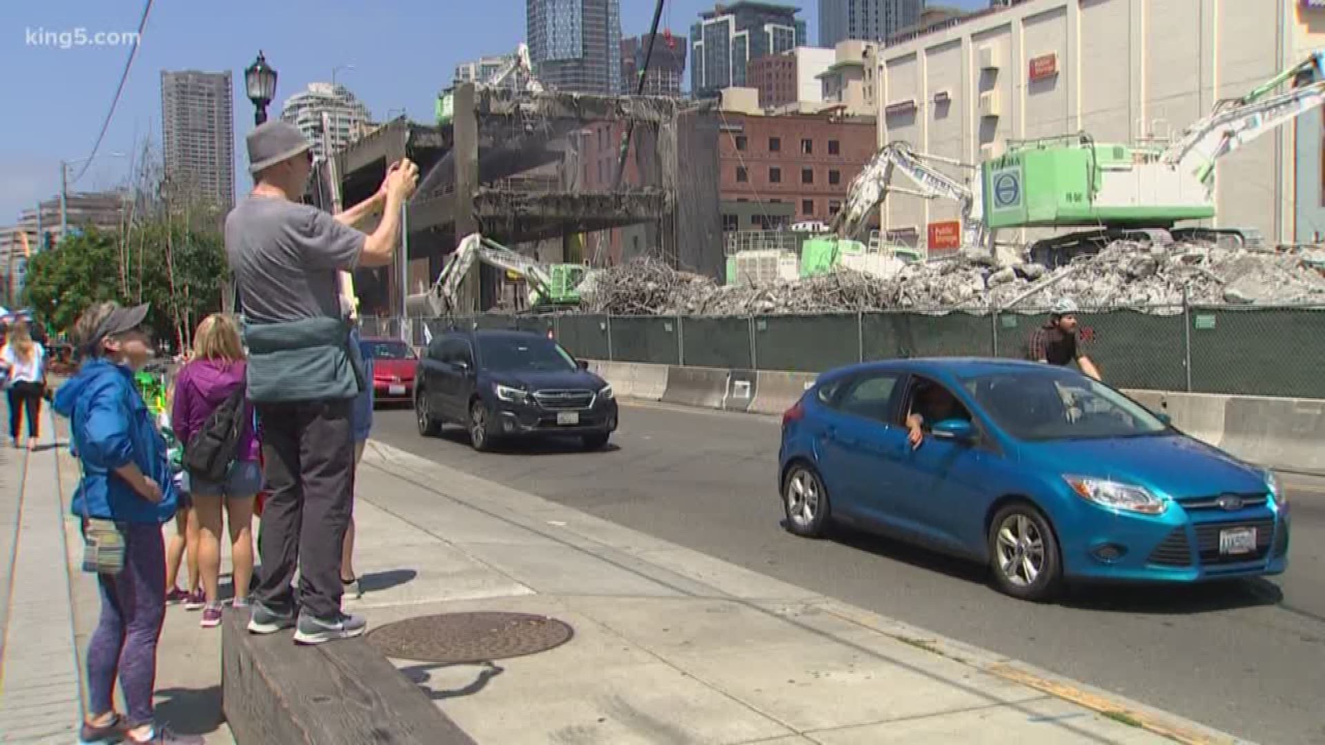 KING 5's Glenn Farley spoke with thrilled tourist who can still see dinosaur like machines eat away at the viaduct, and business owners frustrated with all the commotion.