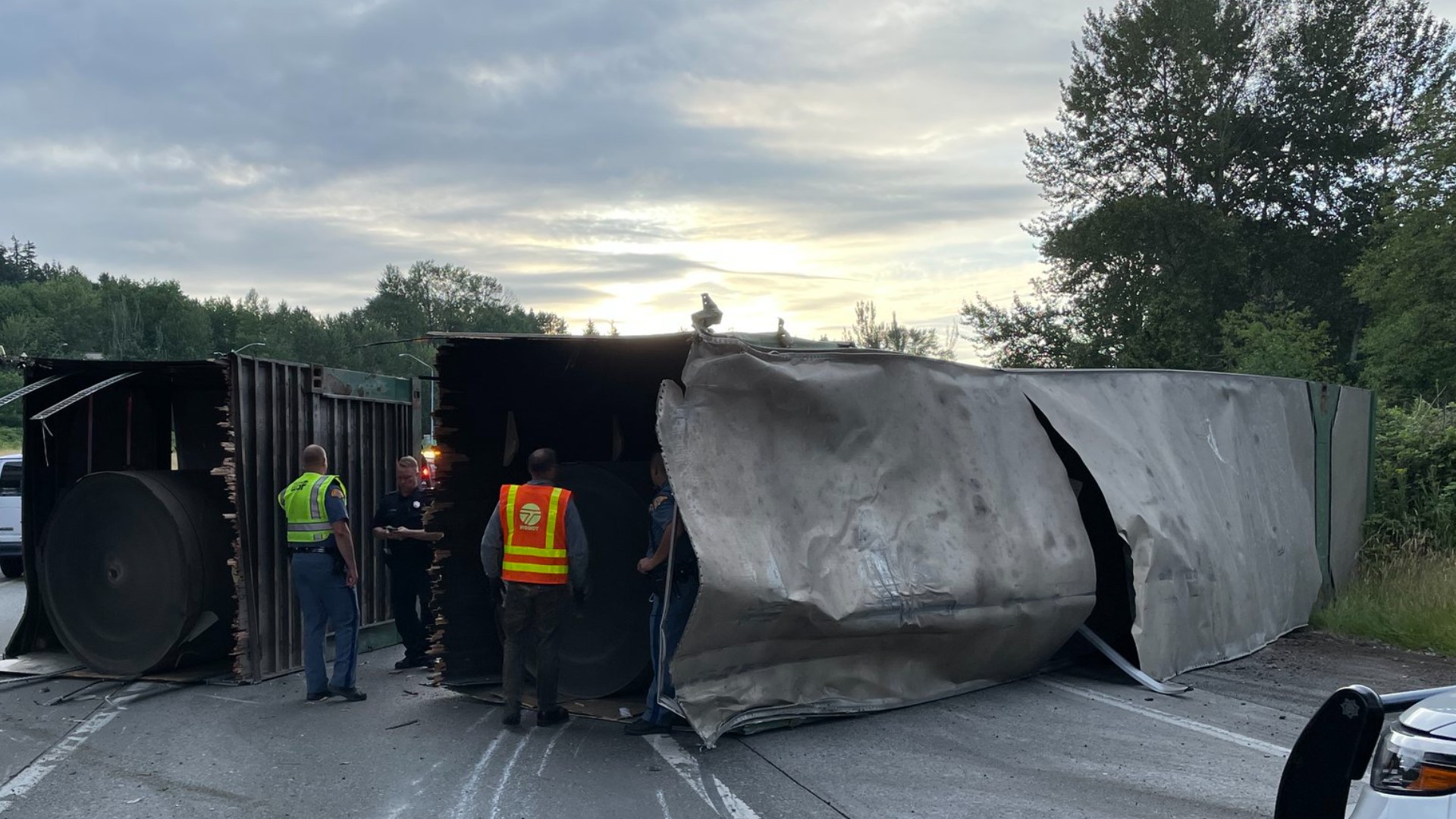 A semi-truck rolled over on northbound Interstate 405 in Tukwila Wednesday morning, causing several lane closures and delays in the Southcenter area.