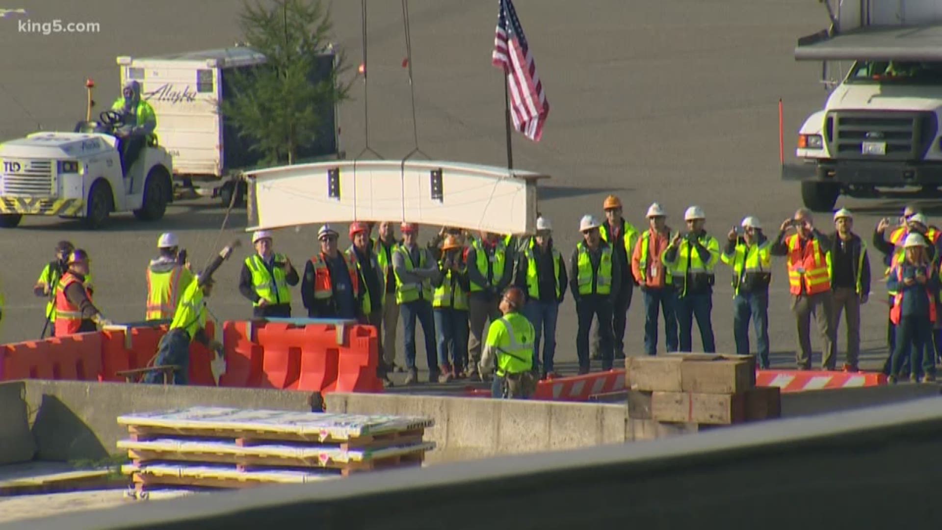 Ironworkers topped out the arched roof structure for Sea-Tac International Airport's newly expanded North Satellite on Nov. 6, 2019.