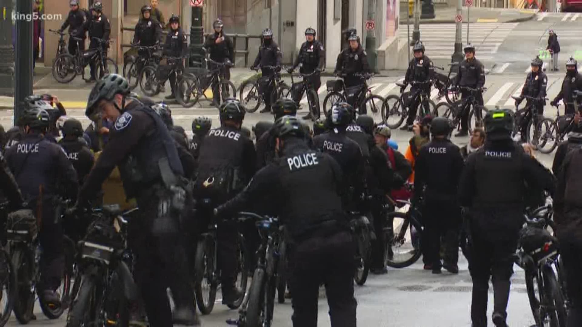 A permitted rally outside Seattle City Hall drew a crowd of counter protesters. KING 5's Kalie Greenberg reports.