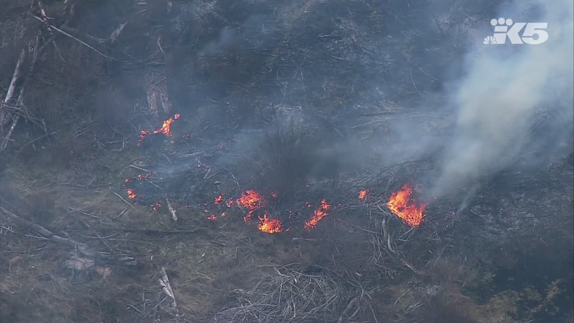 A wildfire burns in Pierce County ahead of the first full day of spring.