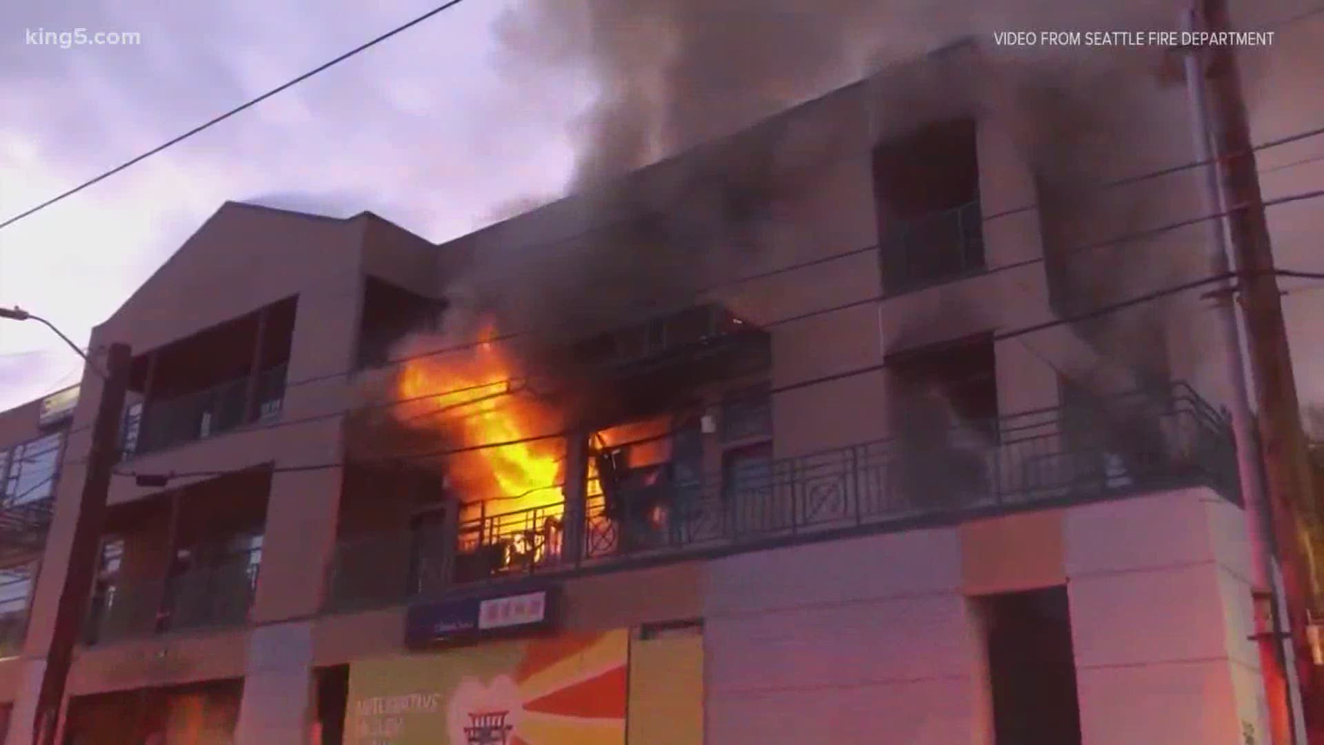 The fire is at a three-story shopping center in Seattle's Chinatown district.