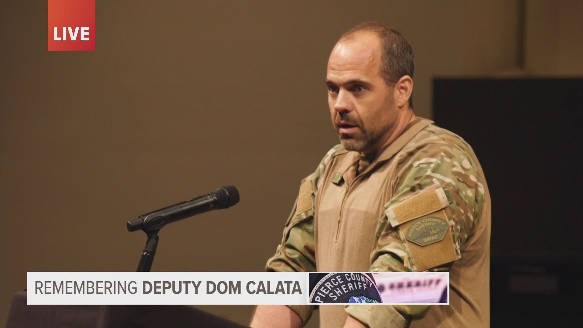 Sgt. Rich Scaniffe, who leads the Pierce County Sheriff's Department SWAT team, speaks at fallen Deputy Dom Calata's celebration of life service.