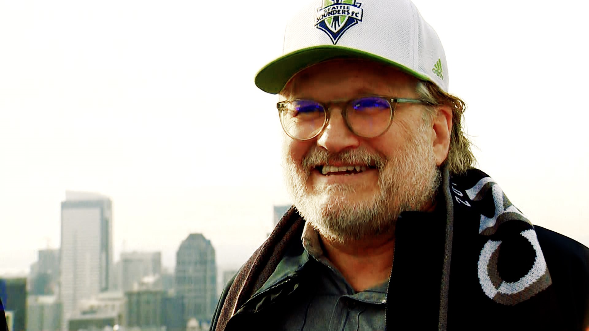Seattle Sounders owner Drew Carey and former Sounder Brad Evans talk about the upcoming match and raise the flag over the city