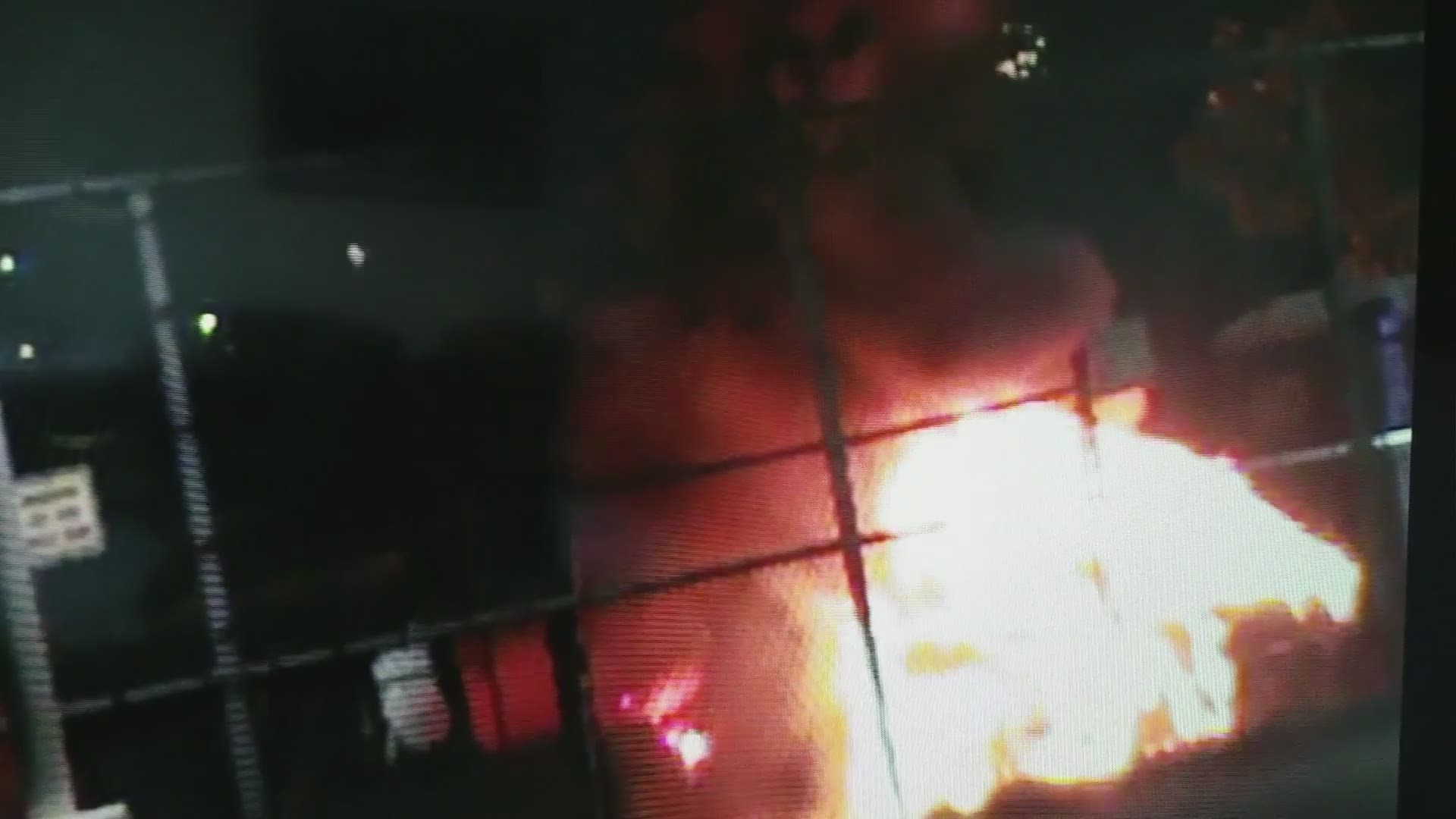 Newly released surveillance video shows a car exploding and the sounds of gunfire during an attack outside a migrant detention center in Tacoma.