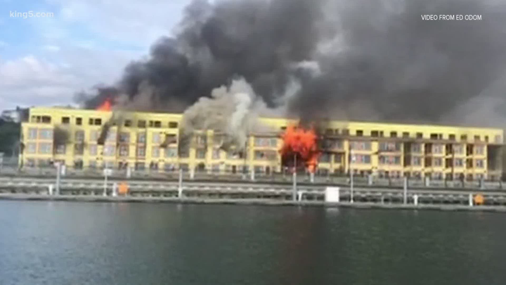 Flames engulfed an apartment building under construction near the Everett Marina on West Marine View Drive. A home and emergency vehicles were also damaged.