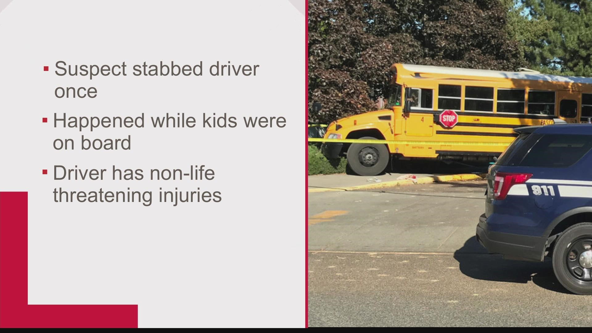 Authorities say they are continuing the investigation after a bus driver was stabbed in front of children