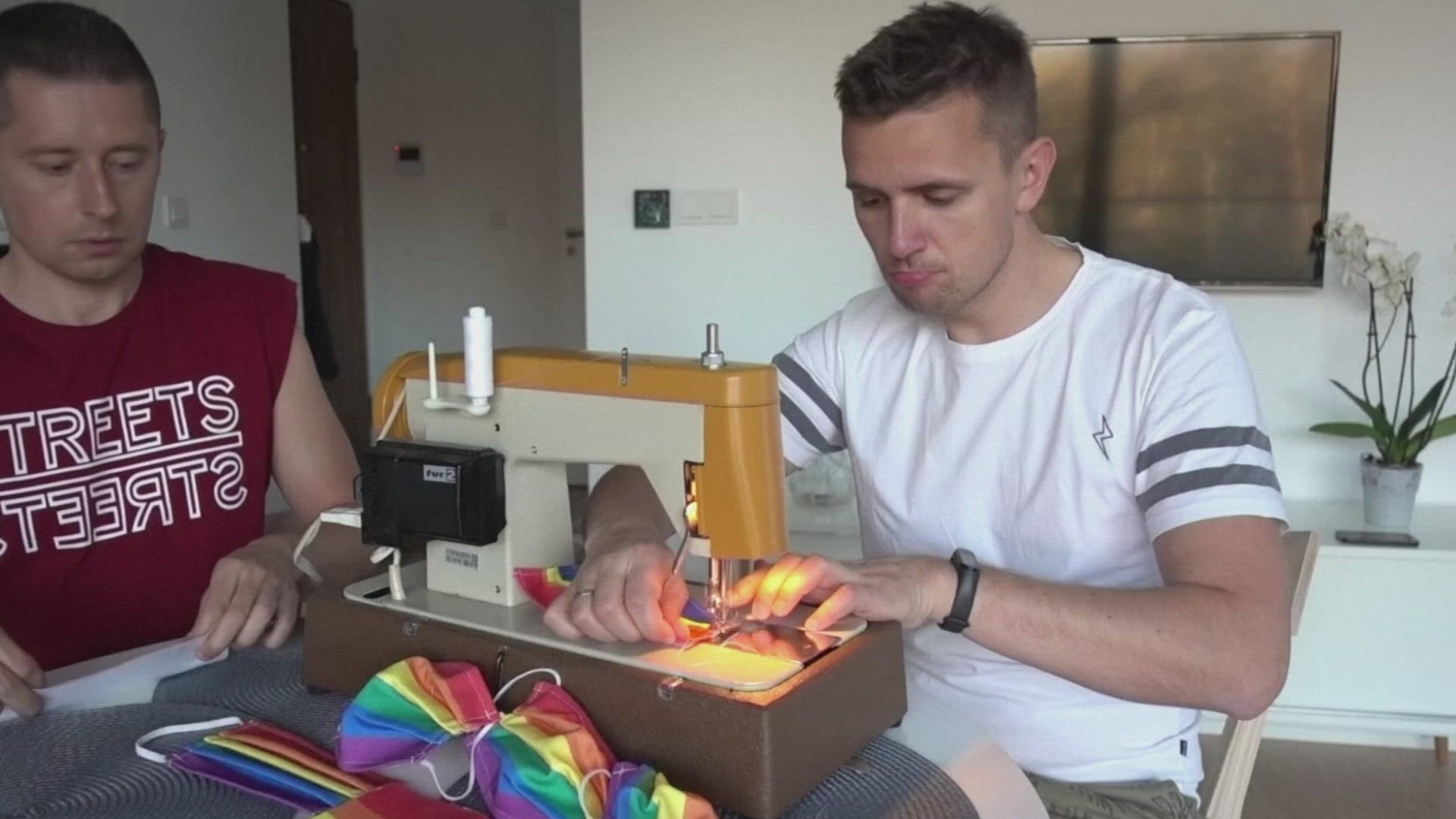 A gay married couple in Poland is handing out rainbow face masks during the coronavirus pandemic, in an effort to combat prejudice against LGBT people in their country.